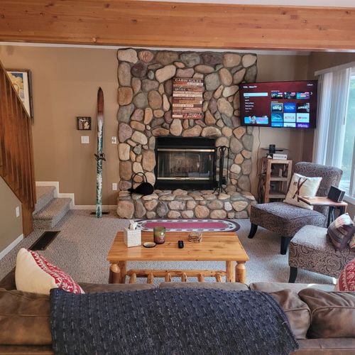 LIVING ROOM:  Adorable and very comfy living room with wood fireplace, sofa, coffee table, comfy chairs, and live streaming television (via Sling).