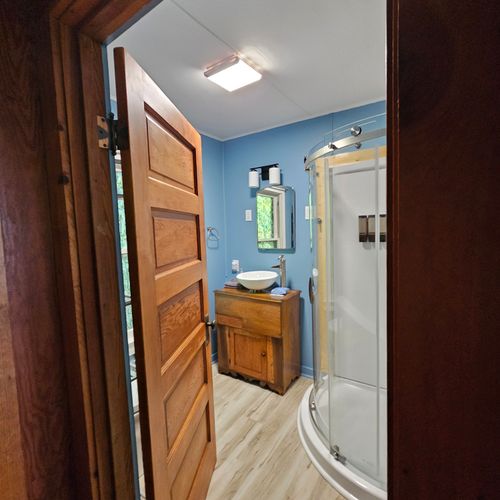 BATHROOM:  The cottage has a cute little full bathroom with a walk-in shower.
