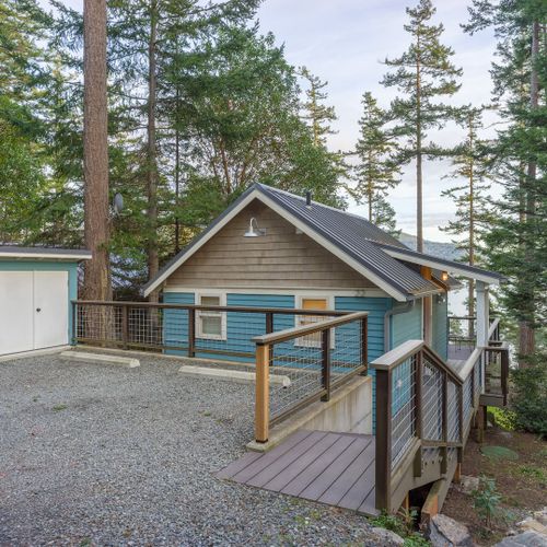 Parking for two cars with an enclosed shed for recycling and waste
