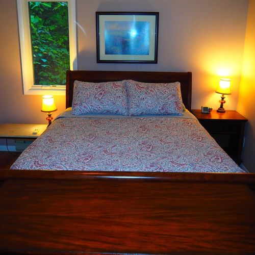 Bedroom #1 (second floor):  features a queen-size bed, nightstands, dresser, ceiling fan, closet, and a private entrance to the second floor bathroom.