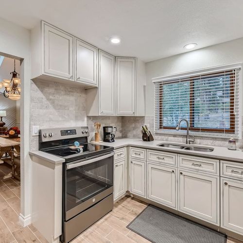 The kitchen connects directly to the dining room area and is fully equipped for you to whip up any gourmet meal.