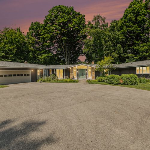 EXTERIOR:  The front of the home at dusk