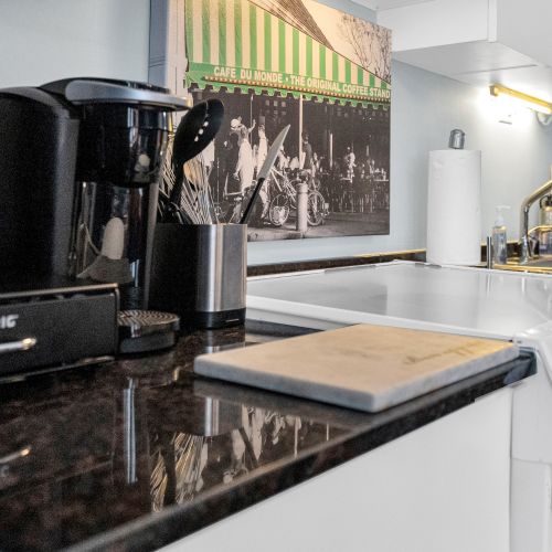 Start your mornings with a taste of New Orleans—our fully equipped kitchen includes a coffee station to fuel your adventures, complete with a nod to the city's iconic Café du Monde.