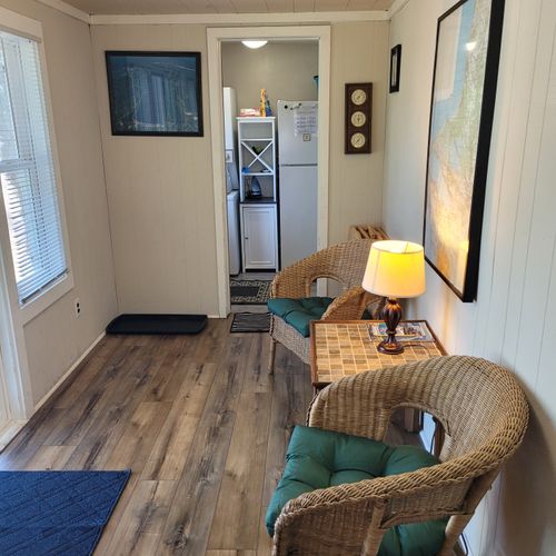 SUN PORCH:  The home has a fully enclosed sun porch with a nice view of Crystal Lake!