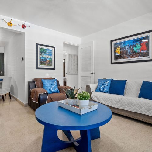 Coastal Comfort: Experience the laid-back luxury of our main living space, tastefully decorated to reflect the beauty of the sea.