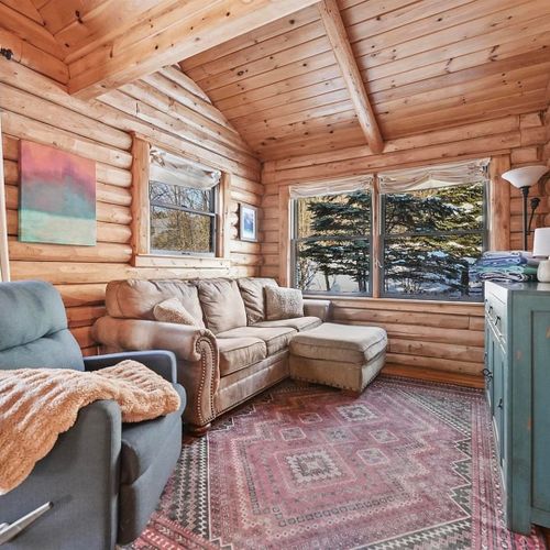 Living room:  the comfy living room with a huge wood fireplace!