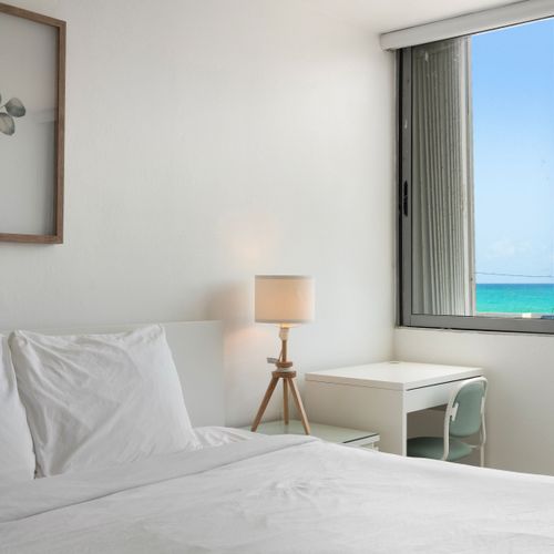 Pristine white linens and a clean design promise a truly undisturbed night's sleep.