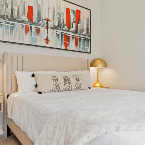 Find restful sleep in a space that blends soft textures, calming tones, and curated art.