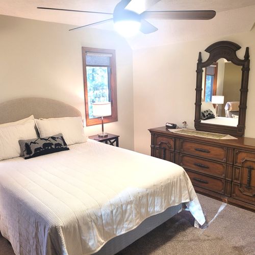 BEDROOM #2 (SECOND FLOOR):  Super cute bedroom with a queen-size bed, ceiling fan, cubby area, closet, dresser, and mirror.