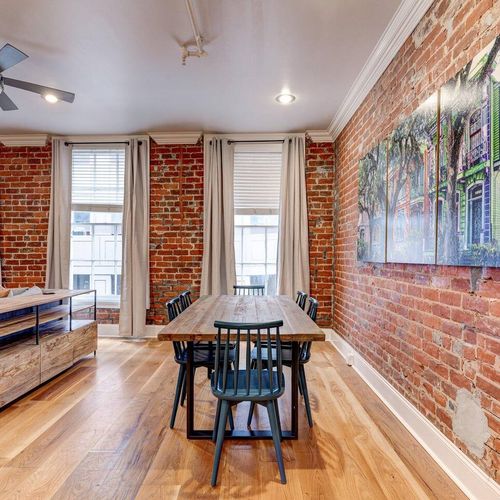 Bright dining area w/ a classic wood table & natural light.