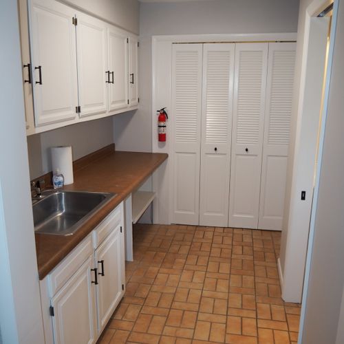 Laundry and mudroom:  convenient laundry room and mudroom with an extra refrigerator. Also includes a half-bathroom.