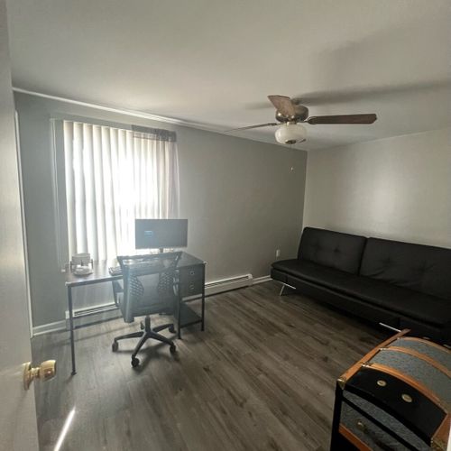 Bedroom #2 (main floor):  includes a futon, workstation (desk, chair, and monitor), ceiling fan, closet, and another lovely lake view!