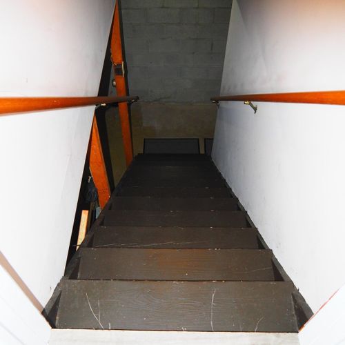 Stairs:  stairs down to the basement, where the washer and dryer is located.