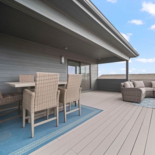 Covered outdoor dining space for relaxed meals and easy enjoyment.