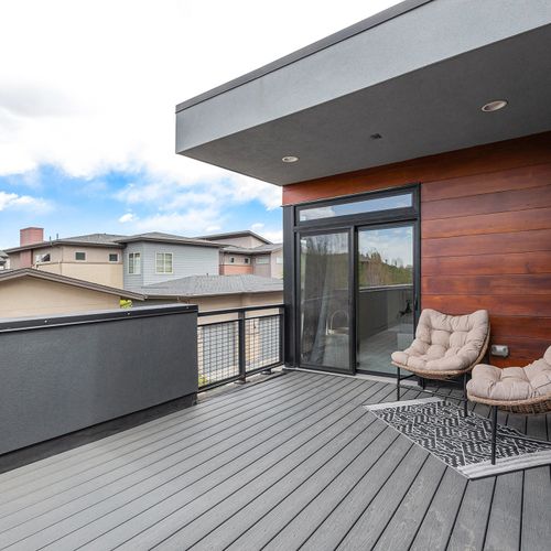 Enjoy the outdoors on this stylish terrace, offering plenty of space to relax and unwind.