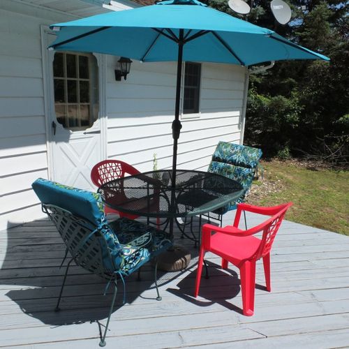 Exterior:  another view of the backyard deck and outdoor dining furniture.