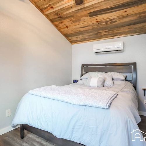 The bedroom has a queen size bed.