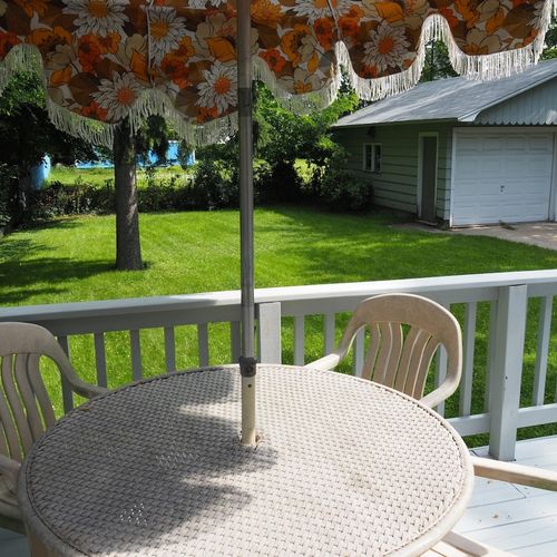Exterior:  looking out at the beautifully green backyard lawn from the backyard deck.