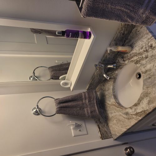 Bathroom #2:  full common bathroom on the main floor with a combination tub and shower.