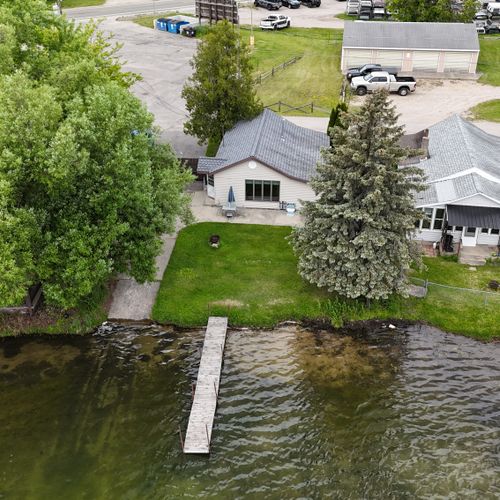 Overall:  a drone shot of the house with the dock in view