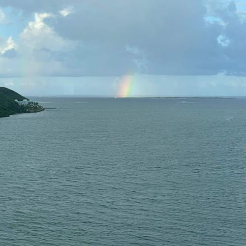 Maritime Magic: Witness the charm of the harbor from your vantage point, with sailboats adding to the idyllic scenery.