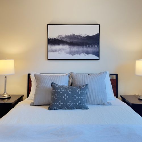 Serene and cozy bedroom with a plush bed, soft lighting, and calming nature-inspired décor.