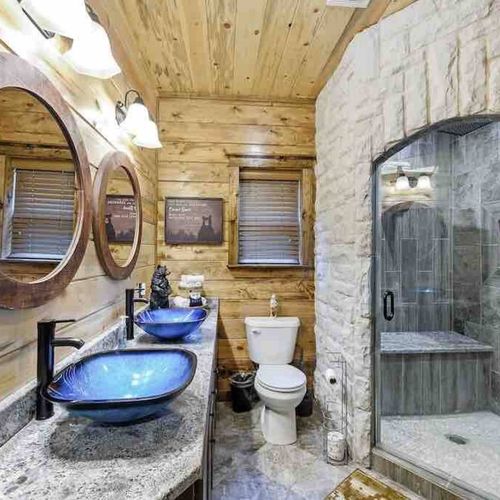 In-suite bathroom with double sink and walk-in shower.
