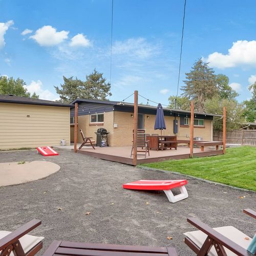 - enjoy outdoor games, comfy seating, and fresh air in this fenced backyard
- cornhole boards, string lights, and patio dining make it fun day or night
- playful outdoor area designed for laughter, lounging, and great memories