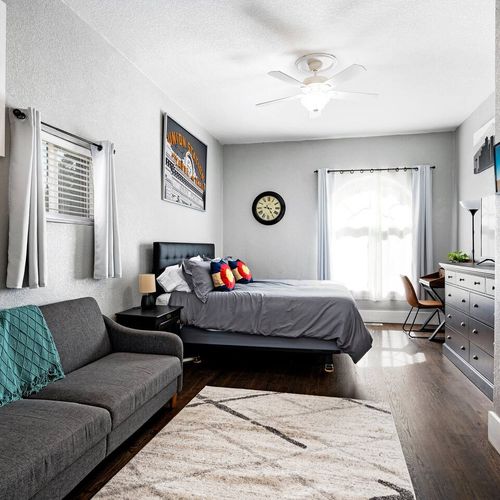 - spacious guest suite with king bed, cozy sofa, and modern decor
- thoughtfully styled with colorado themed pillows and local artwork
- natural light, dark wood floors, and a soft rug create a calming vibe