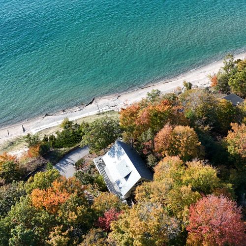 FALL:  Aerial view of the cottage and lake, highlighting the beautiful Fall colors