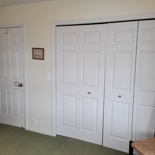 Bedroom #4 (upper level):  very large bedroom featuring a queen-size bed, credenza, ceiling fan, closet, chair, and great views of lake michigan!