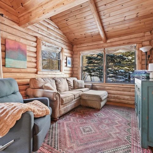 Living room:  the comfy living room with a huge wood fireplace!