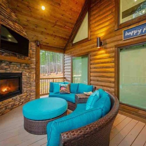 The outdoor sofa around the gas fireplace.