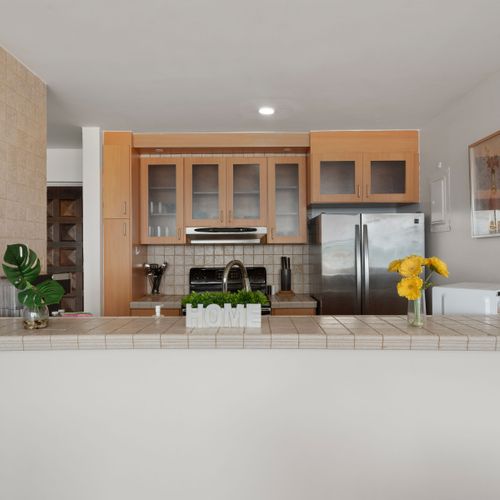 Fully stocked kitchen with modern appliances. Prepare delicious meals with ease.