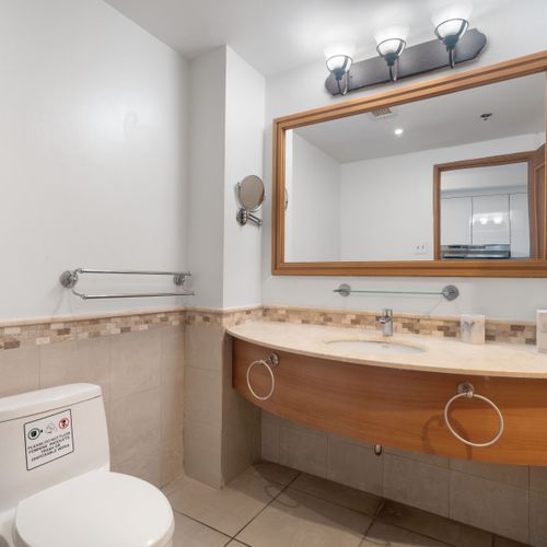 Modern & well-appointed, our bathroom provides a refreshing space to prepare for your day or wind down.