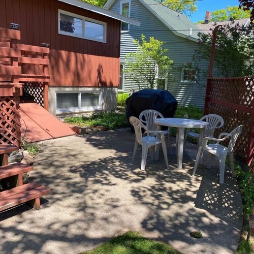 Exterior:  the backyard dining area and propane grill.