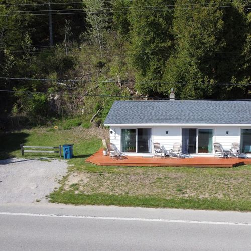 Exterior:  the cottage and the parking area
