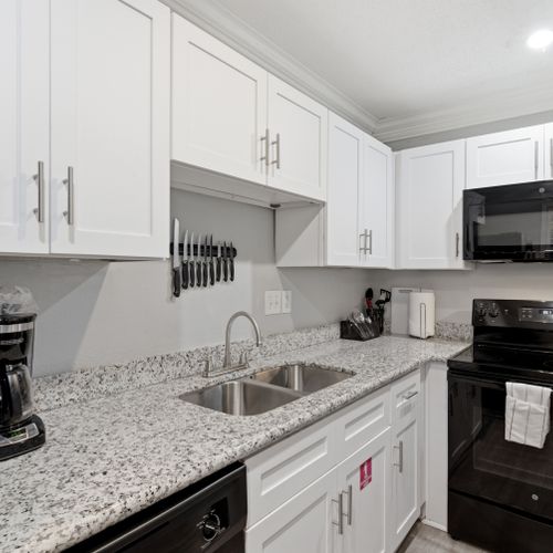 Modern kitchen w/ ample counter space & everything you need for home-cooked meals.