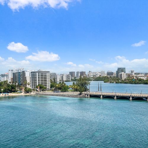 Expansive ocean views from your balcony, overlooking the stunning Condado Lagoon and coastline.