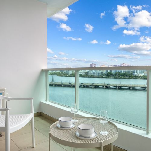 Wake up to stunning lagoon views from your comfortable bed, with direct balcony access.