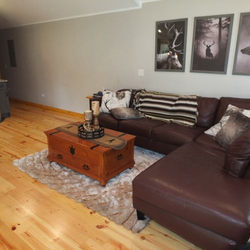 Living room:  another angle showing the proximity to the kitchen and the hall that goes to the bedrooms (at the back of the photo).