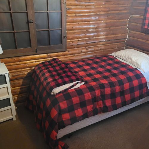 Bedroom #2:  features 2 twin size beds, nightstand, lamp, closet, and dresser