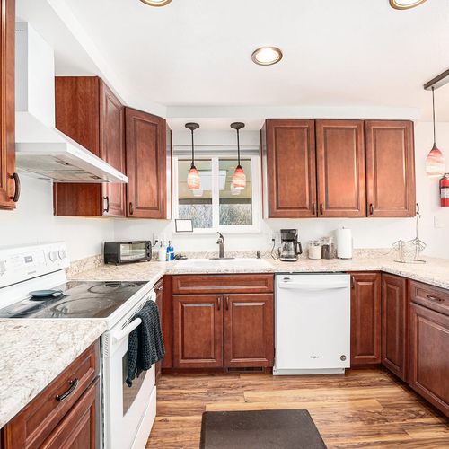 - spacious countertops and plenty of storage await your inner chef’s creativity
- brew your morning coffee with a view and start the day in this sunlit space
- chic pendant lights and patio access make this kitchen the heart of the home