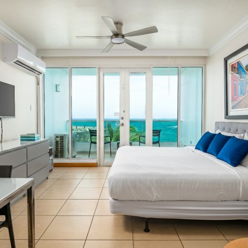 Design-forward bedroom. Plush pillows & crisp, clean linens for your perfect getaway.