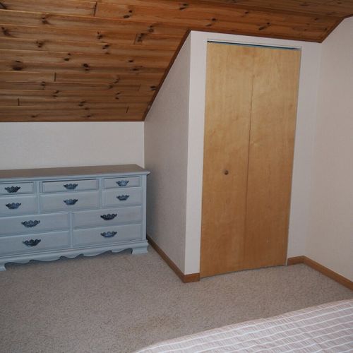 Bedroom #3 (upstairs):  features a full-size bed, dresser, and closet.