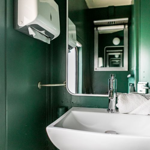 First bathroom located inside train car.