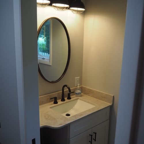 Bathroom #3 (first floor):  half-bathroom on the main floor. Located inside the laundry room.