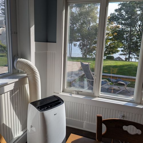 LARGER HOUSE - LIVING ROOM:  Comfy living room with great views of the backyard and Lake Huron!  The living room also has a portable A/C unit.