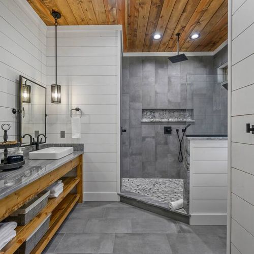 The private bath has an oversized walk-in shower and double vanity.