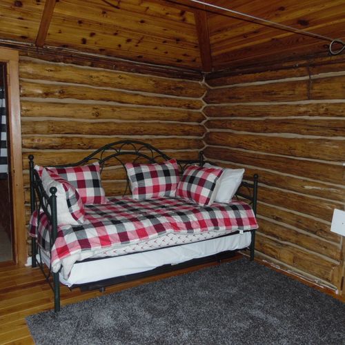 Interior:  a picture of the bed. (will be getting replaced with a queen-size bed. )